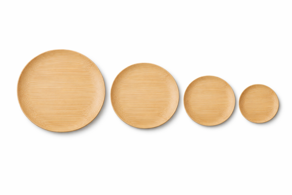 Four bamboo plates arranged by size from large bamboo dinner plate to small appetizer plate — showing size comparison of bamboo dining plates from 6 to 12 inches
